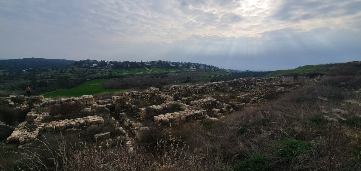 Archaeological ruins at Tel Gezer with dramatic sky