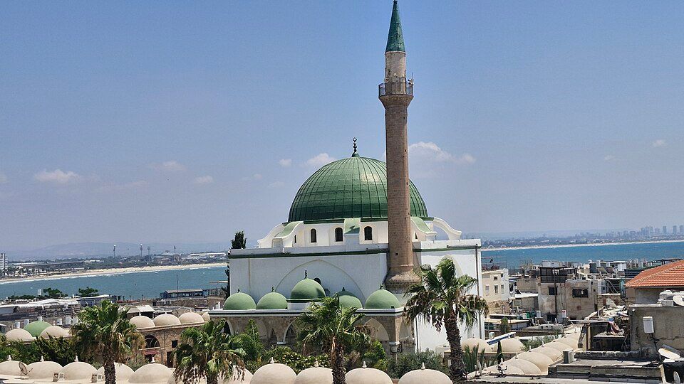 The Al-Jazzar Mosque in Akko with its green dome and minaret