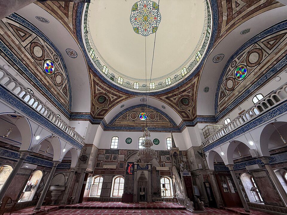 Inside the Al-Jazzar Mosque with the painted dome and stained glass