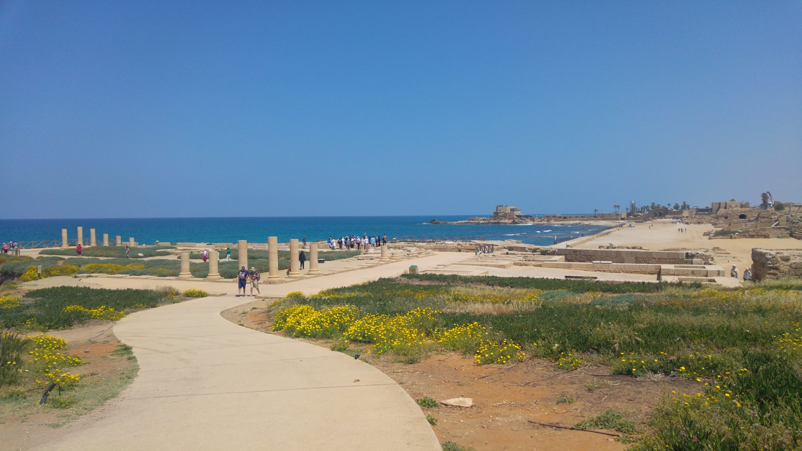 Caesarea archaeological park with Roman columns, walking paths and the Mediterranean Sea