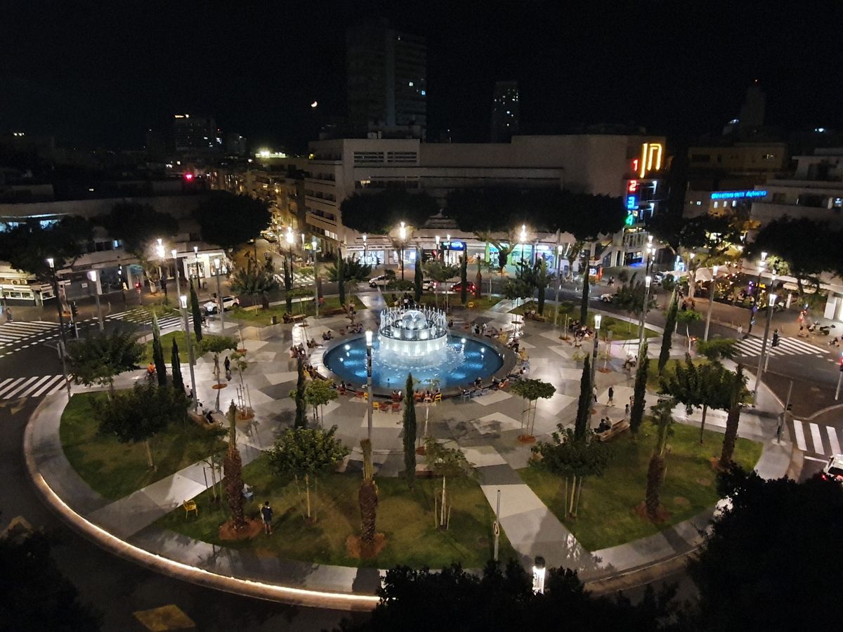 Dizengoff Square in Tel Aviv at night with the illuminated fountain