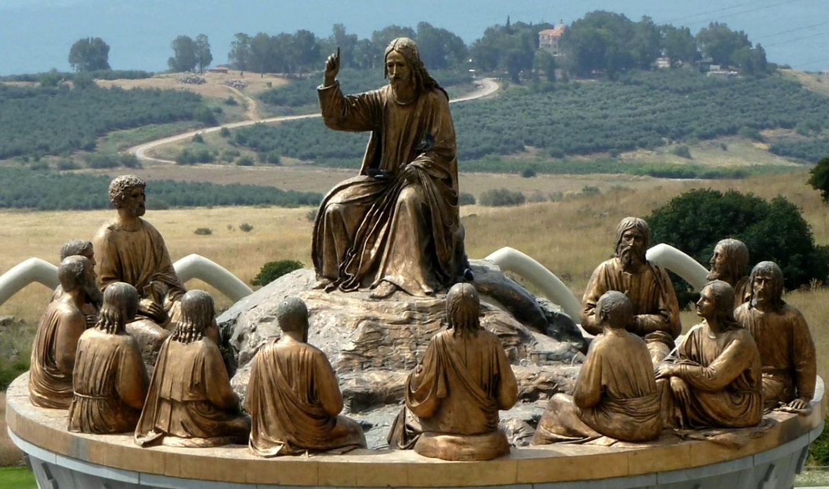 Bronze sculpture of Jesus teaching the twelve disciples at Domus Galilaeae, overlooking the Sea of Galilee