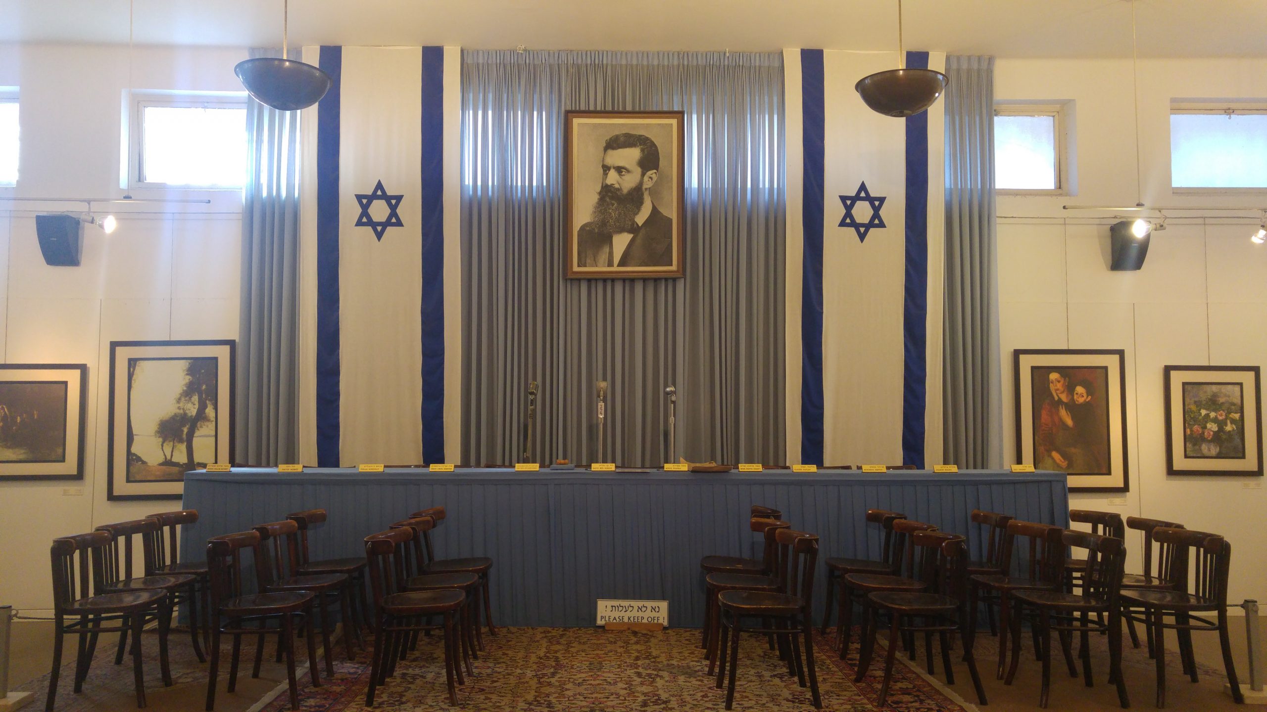 Independence Hall in Tel Aviv where Ben-Gurion declared the State of Israel, with Herzl portrait and flags