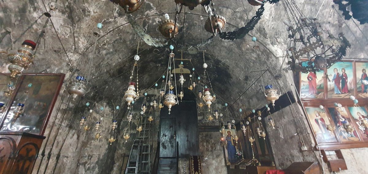 Inside the Tomb of the Virgin Mary, oil lamps and icons, Jerusalem