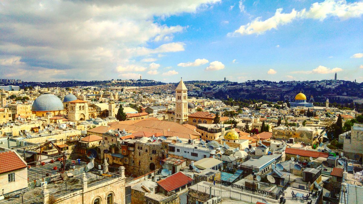 Panoramic view of the Old City rooftops with the Holy Sepulchre dome and the Dome of the Rock