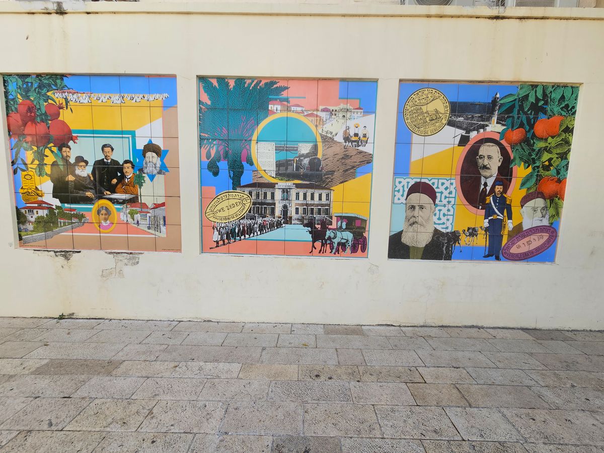 Historic mosaic wall art depicting the founders of Neve Tzedek