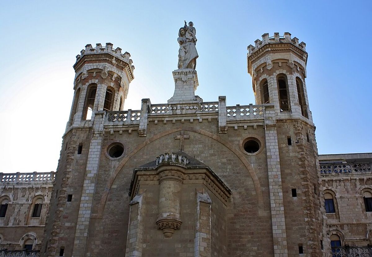 Notre Dame of Jerusalem facade with towers and statue