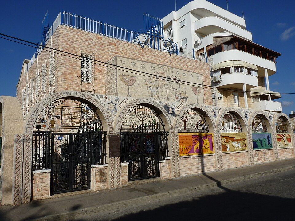 The colorful mosaic-covered facade of the Or Torah Tunisian Synagogue in Akko