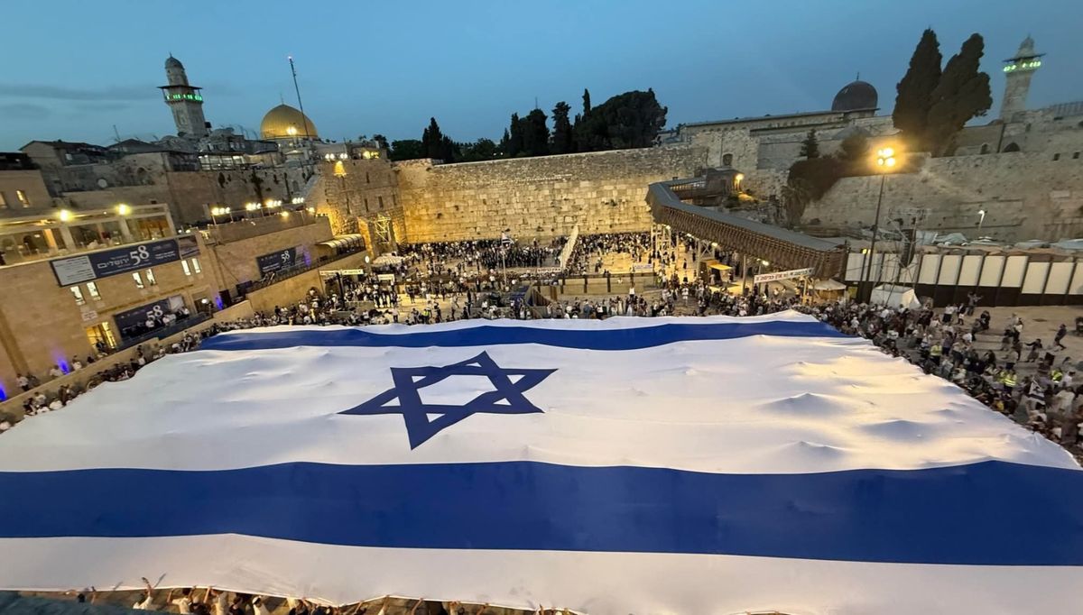 The Western Wall plaza with a giant Israeli flag