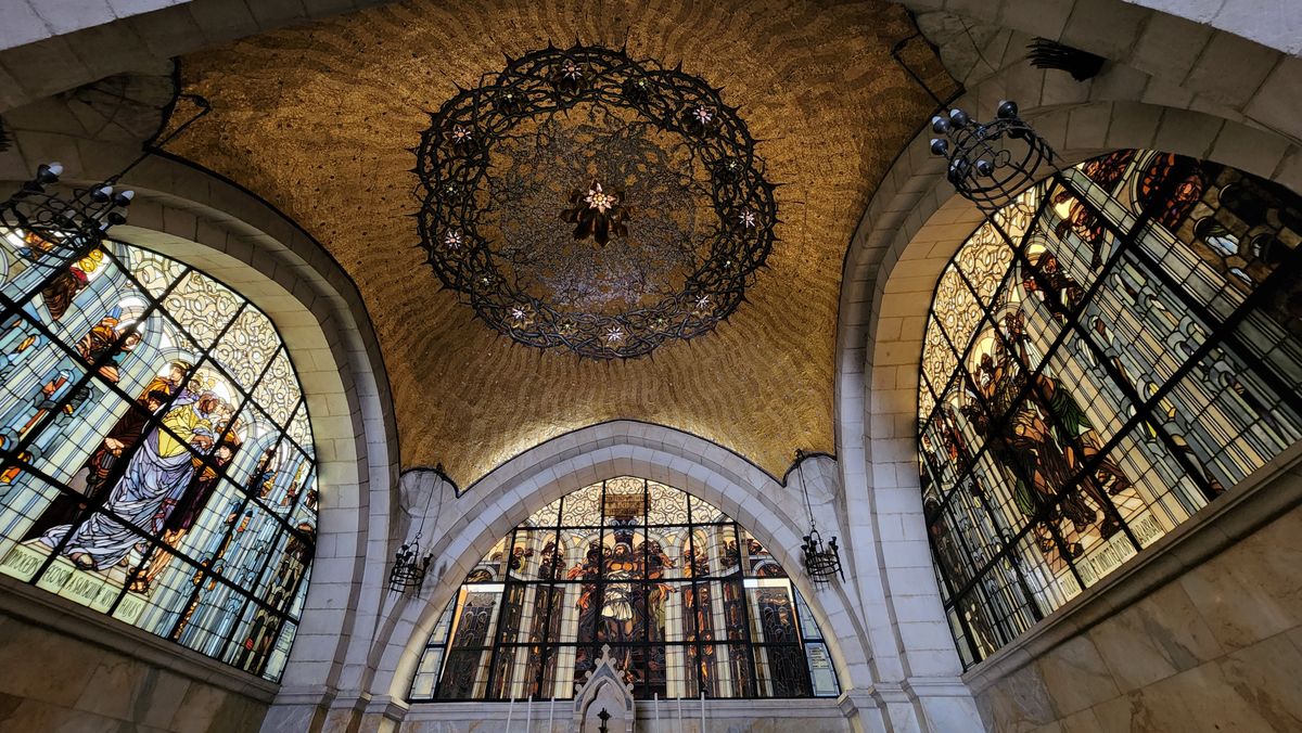 Interior of the Church of the Condemnation at Station 2 on the Via Dolorosa, with stained glass windows and crown of thorns chandelier